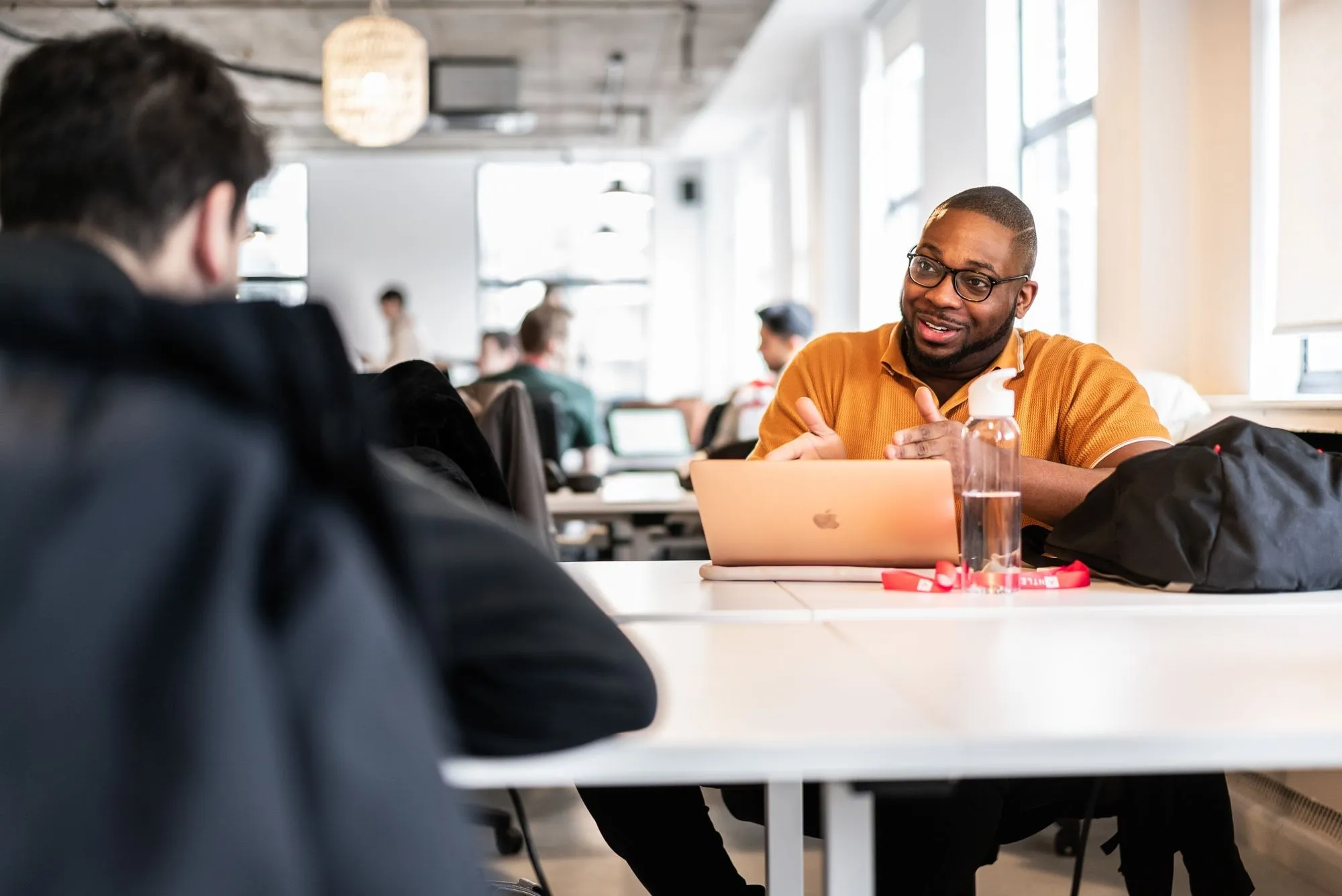 A founder talking one to one across a desk in the Antler office